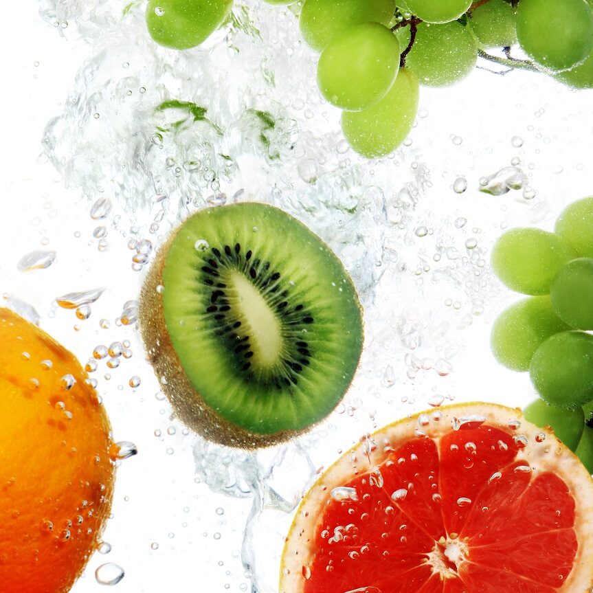 Fresh fruits dropped into water